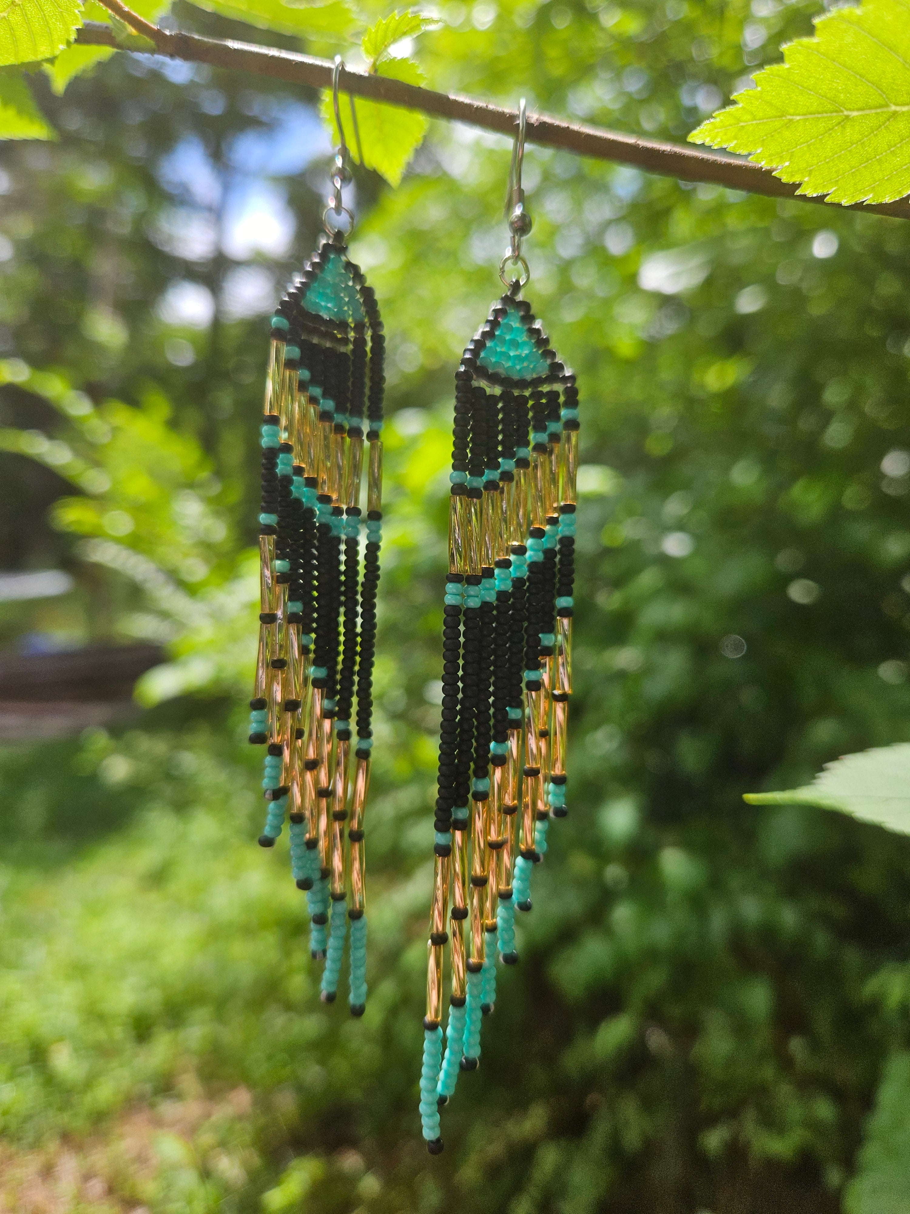 Handmade turquoise and gold beaded fringe earrings featuring intricate beadwork and a bold statement design. Perfect for boho fashion lovers and unique jewelry collections.