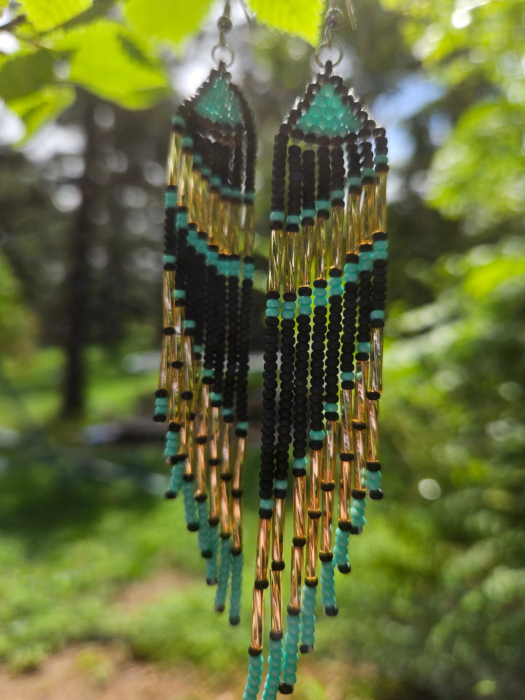 Handmade turquoise and gold beaded fringe earrings featuring intricate beadwork and a bold statement design. Perfect for boho fashion lovers and unique jewelry collections.