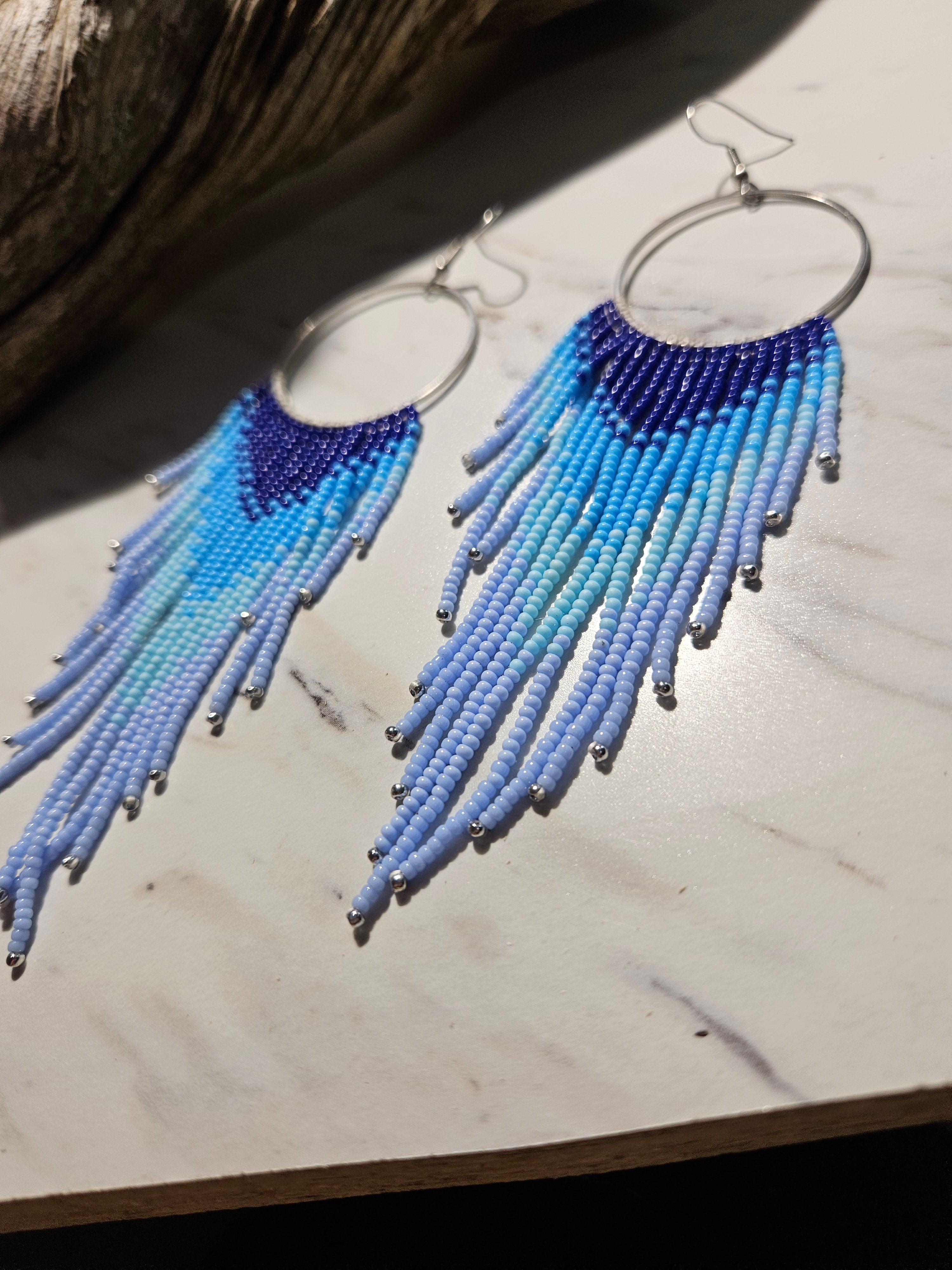 Flying free blue fringe earrings