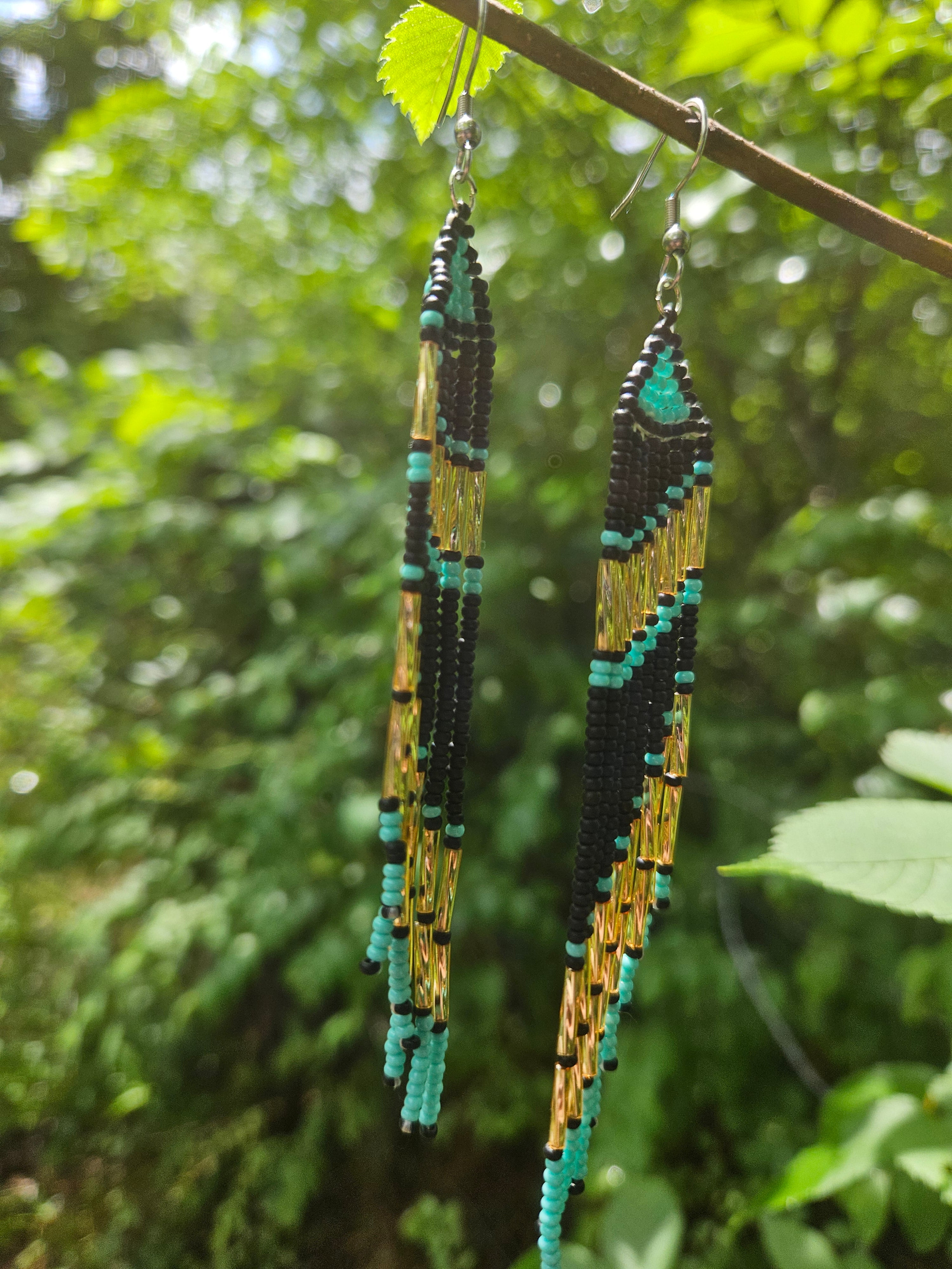 Handmade turquoise and gold beaded fringe earrings featuring intricate beadwork and a bold statement design. Perfect for boho fashion lovers and unique jewelry collections.