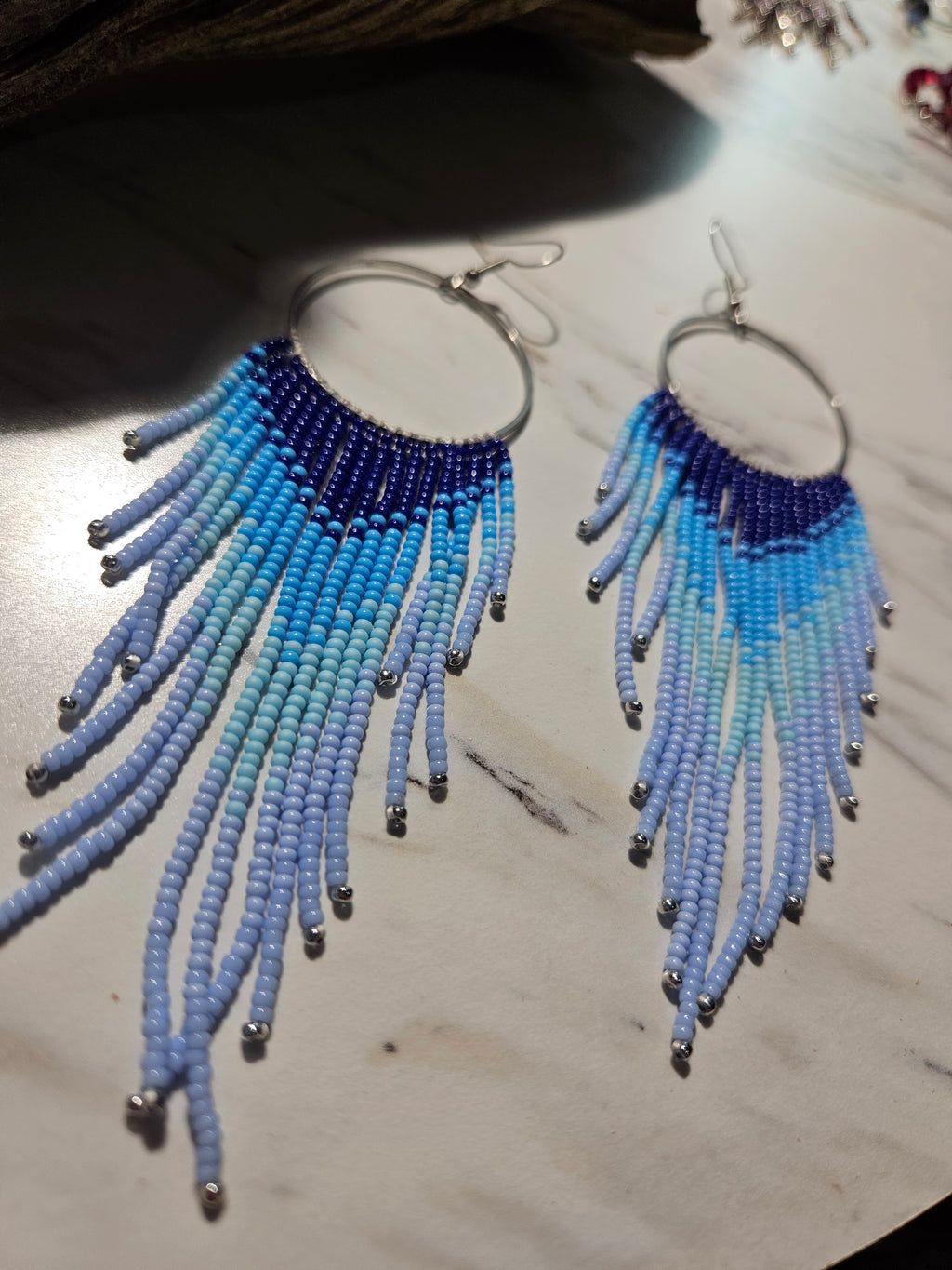 Flying free blue fringe earrings